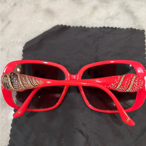 Judith Leiber Sunglasses! Amazing Barbie pink. She’ll crystals on the temples